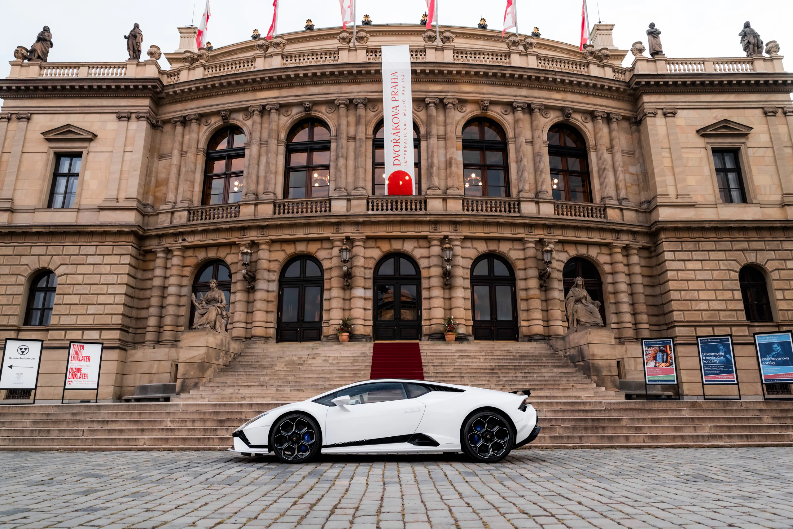 White Lamborghini Huracán Tecnica in profile in front of the Rudolfinum, Prague