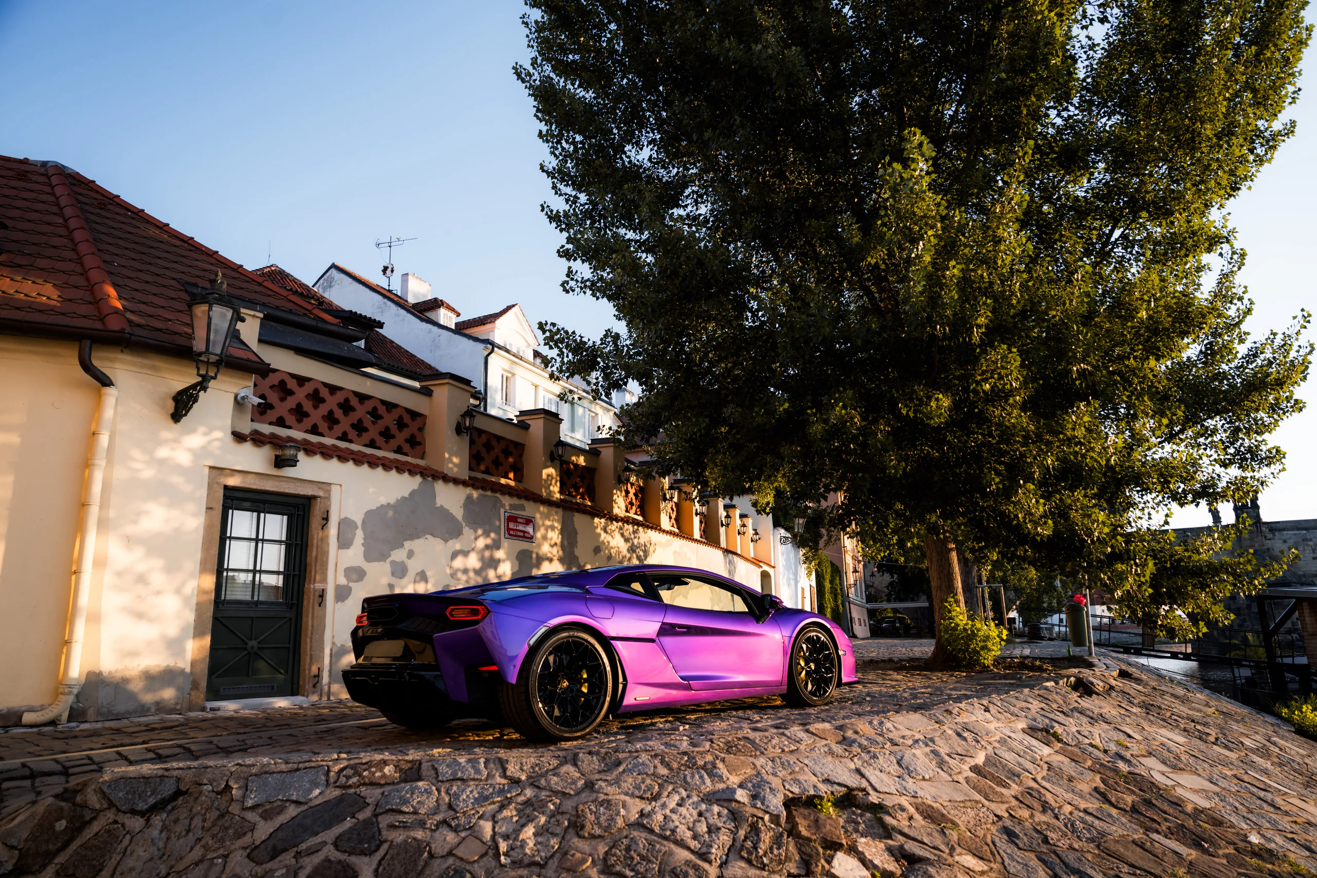 Lamborghini Temerario at golden hour outside an old Prague house